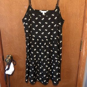 Charming Charlie’s black mini dress with daisies.